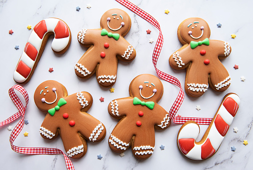 Christmas gingerbread cookies  on a white marble background.  Homemade delicious Christmas gingerbread