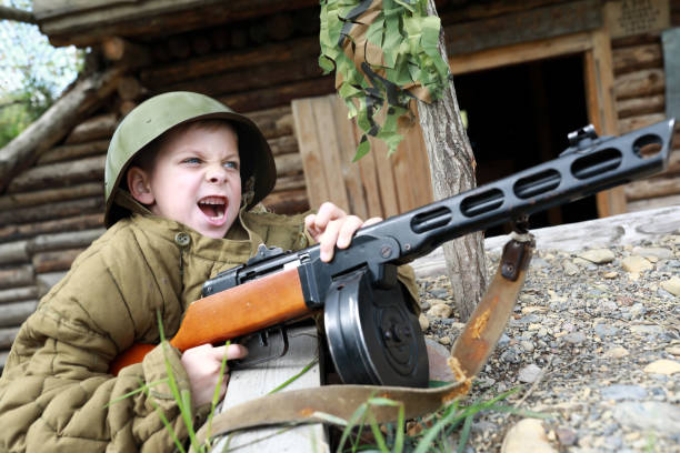 Screaming child shooting PPSh-41 submachine gun
