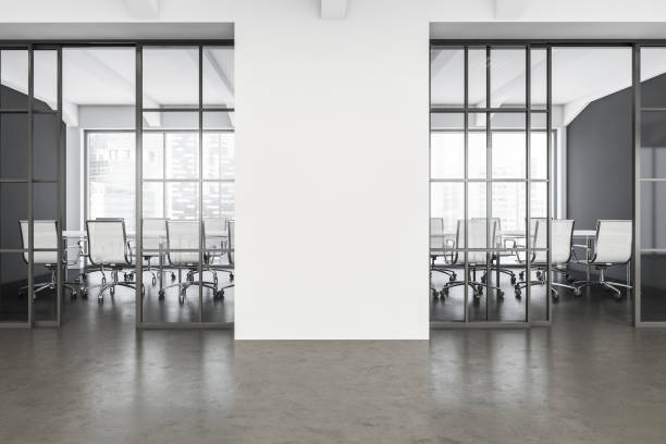 istock White and grey office space with sliding doors and panoramic conference room 1345948410