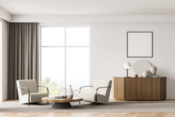 istock Living room interior with white empty poster, two armchairs 1345948489
