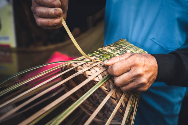 istock Hands weaving bamboo baskets at home 1345948516