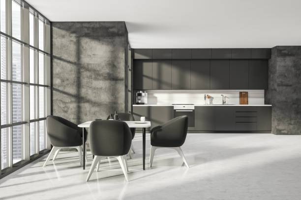 istock Dark kitchen room interior with concrete floor with four armchairs 1345949849