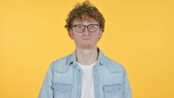 istock Disliking Redhead Young Man Reacting on Yellow Background 1345950172