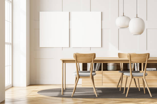 istock Two canvases over a table in a white living room 1345950209