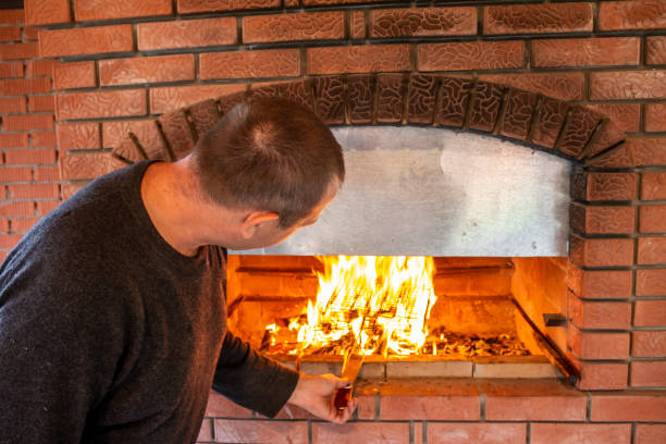 istock man doing barbecue, grilling kebabs on the fire in the oven 1345950914