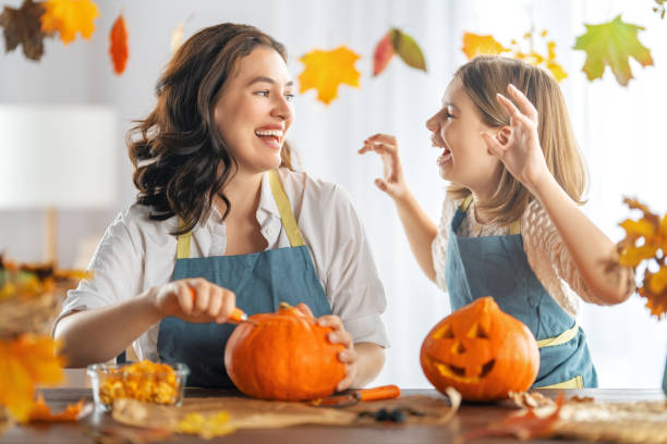 istock family preparing for Halloween 1345951574