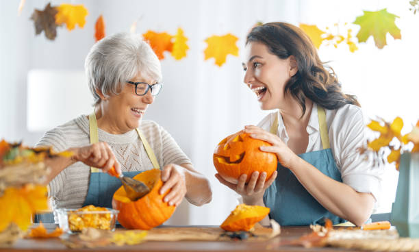 istock family preparing for Halloween 1345951784