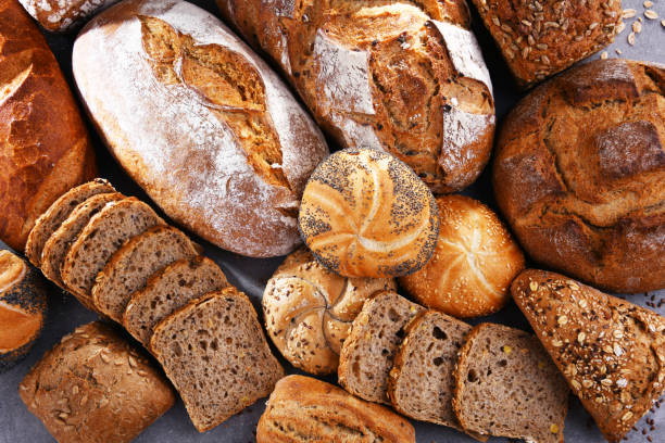 istock Assorted bakery products including loafs of bread and rolls 1345951817