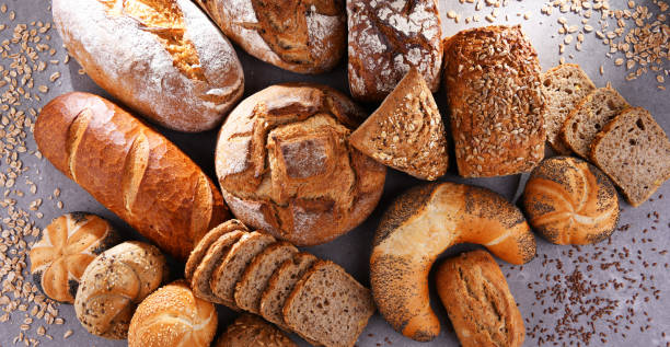 istock Assorted bakery products including loafs of bread and rolls 1345951840