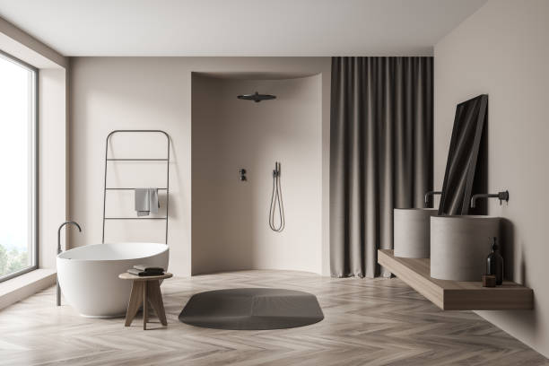 istock Bright bathroom interior with bathtub, shower, sink, mirror, panoramic window 1345951861
