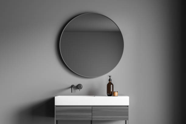 istock Dark grey bathroom wall with a stylish vanity 1345951932