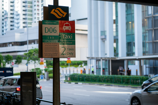 Singapore, Sep 30, 2021 Taxi stand sign downtown Singapore in a sunny afternoon. Horizontal shot