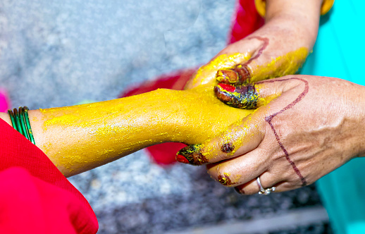 istock An indian bridal turmeric haldi paste on her hand 1345952292