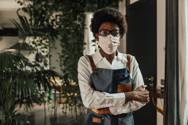 istock Young barista posing looking at camera 1345952605