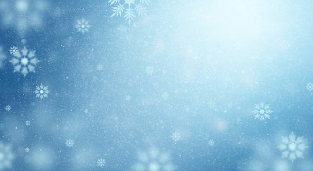 istock Winter illustration with white light and snowflakes floating in space. snow dust on a blue background and white snowflakes. 1345953940