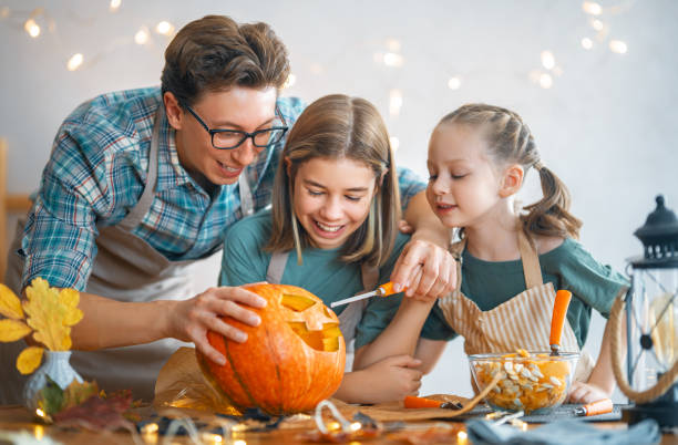 istock family preparing for Halloween 1345954746