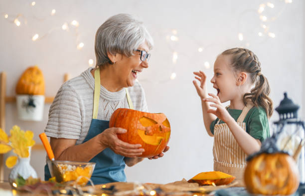 istock family preparing for Halloween 1345954752