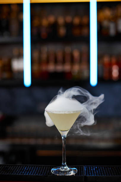 istock the exotic alcoholic cocktail with the smoke 1345954783