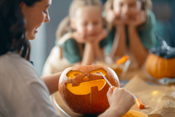 istock family preparing for Halloween 1345954785