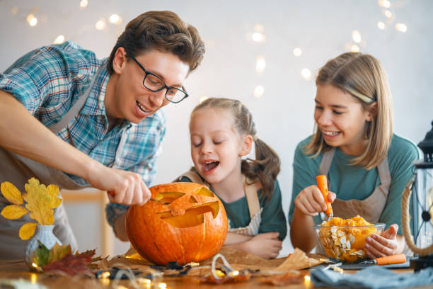 istock family preparing for Halloween 1345954844
