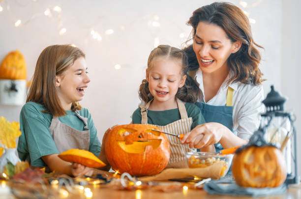 istock family preparing for Halloween 1345954859