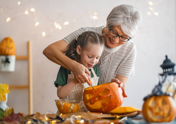 istock family preparing for Halloween 1345954864