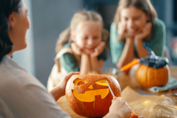 istock family preparing for Halloween 1345954873