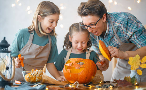 istock family preparing for Halloween 1345954902