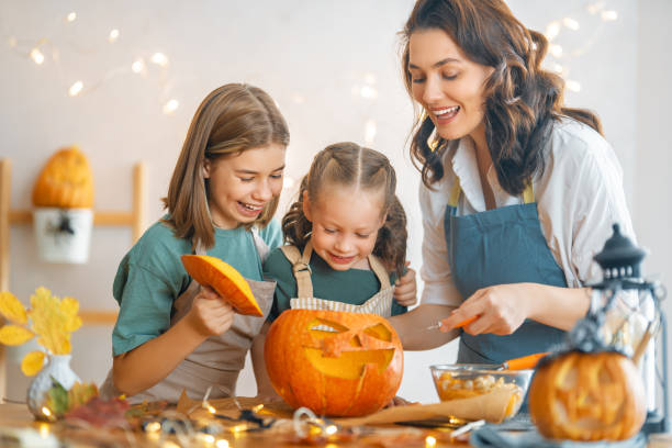 istock family preparing for Halloween 1345954915