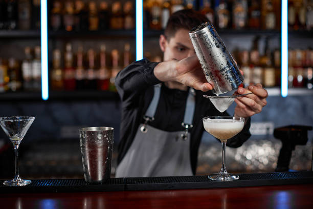 istock professional bartender makes cocktail in a nightclub. 1345955450