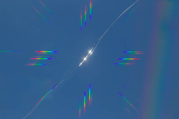 Abstract rainbow lens flare effect on a crack in the window, cross refraction effect