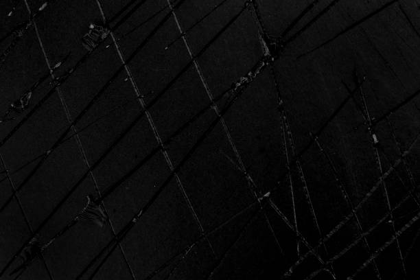 istock Black damaged cracked grunge paper. Old scratched torn cardboard material 1345958191