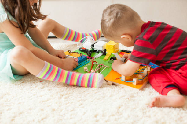 istock Cute Boy Playing With Toy Toys 1345959270