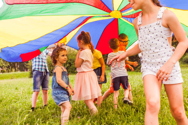 istock Rear View Of People With Multi Colored Umbrella 1345959330