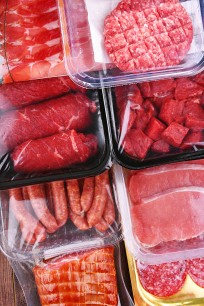 istock Composition with packages of assorted meat products 1345959703