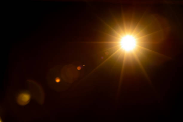 istock Sun flare on the black background 1345965223