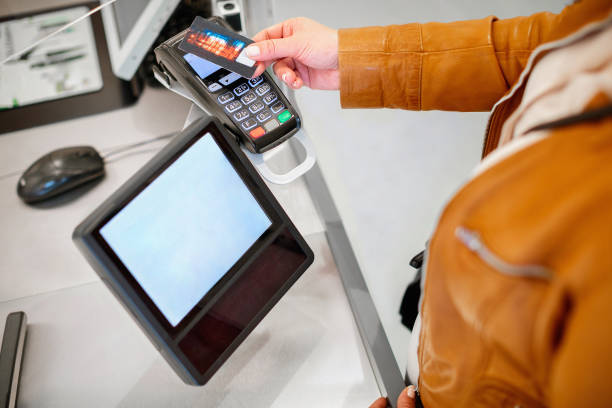 istock Paying with credit card at the retail counter 1345965367