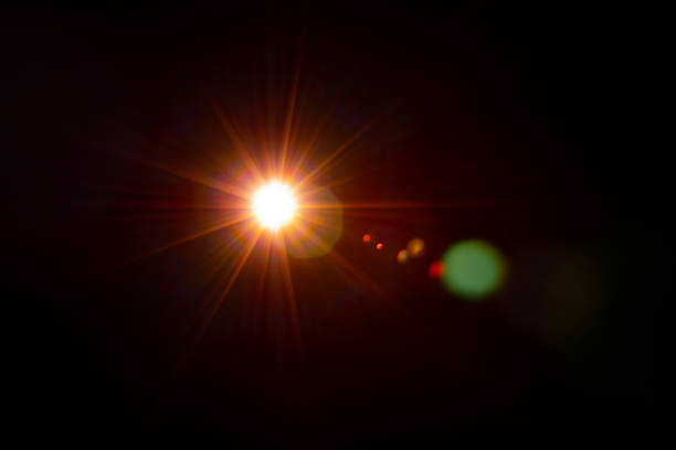 istock Sun flare on the black background 1345965994