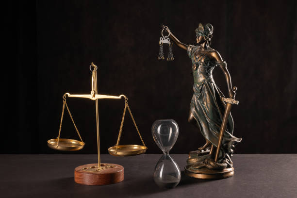 istock Lady Justice or Themis or Justilia (Goddess of justice) on black background 1345966465