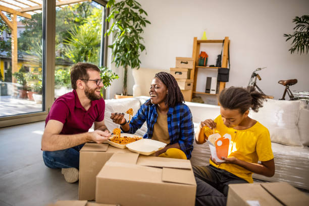 istock Multiethnic family moving in new home 1345967578