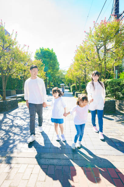 istock 4 family members taking a walk 1345971110