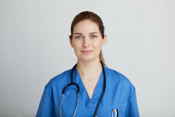A female nurse looking at the camera.