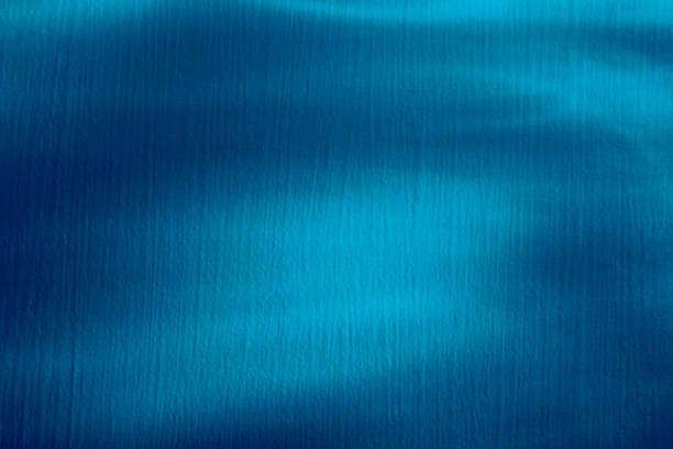 istock Blue color background. Awesome abstract blur texture for website mockup. Blurred beams, light rays. Water wallpaper. Art decor. Waves pattern. Swimming or spa design concept. Business card template 1345973633