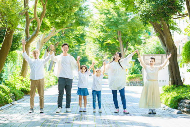 3 generation family holding hands - family senior adult healthy lifestyle happiness imagens e fotografias de stock