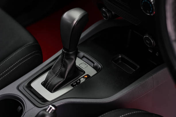 istock automatic transmission shift selector in the car interior. Closeup a manual shift of modern car gear shifter. 1345975220