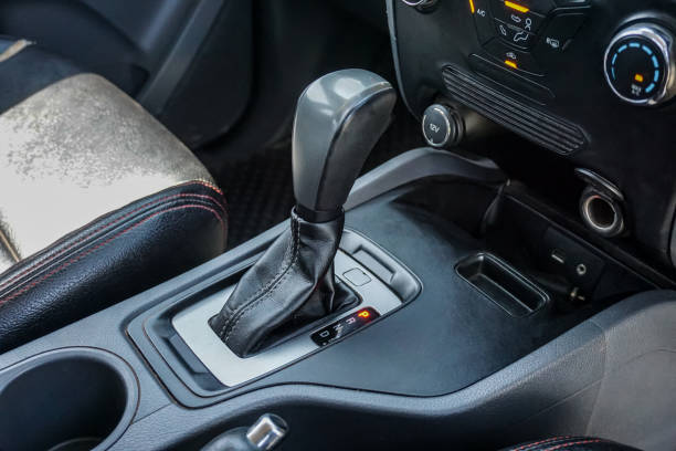 istock automatic transmission shift selector in the car interior. Closeup a manual shift of modern car gear shifter. 1345975402