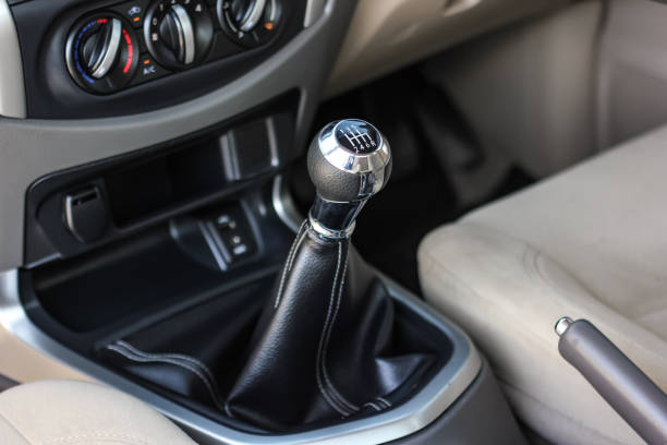 istock automatic transmission shift selector in the car interior. Closeup a manual shift of modern car gear shifter. 1345975459