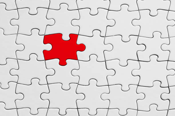 istock Red jigsaw puzzle piece stands out from the crowd. Diversity, unique or difference 1345976314