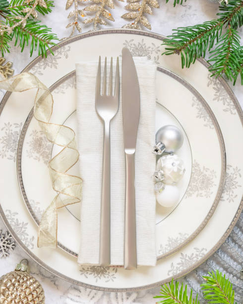 istock Festive table setting with fir tree branches and Christmas decorations 1345976389