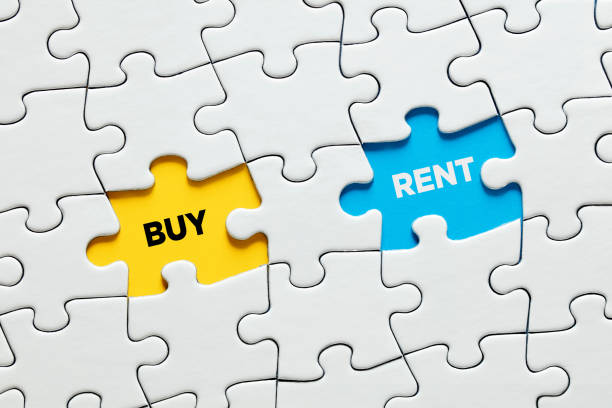 istock Missing puzzle pieces with the words buy and rent. Business decision 1345976438